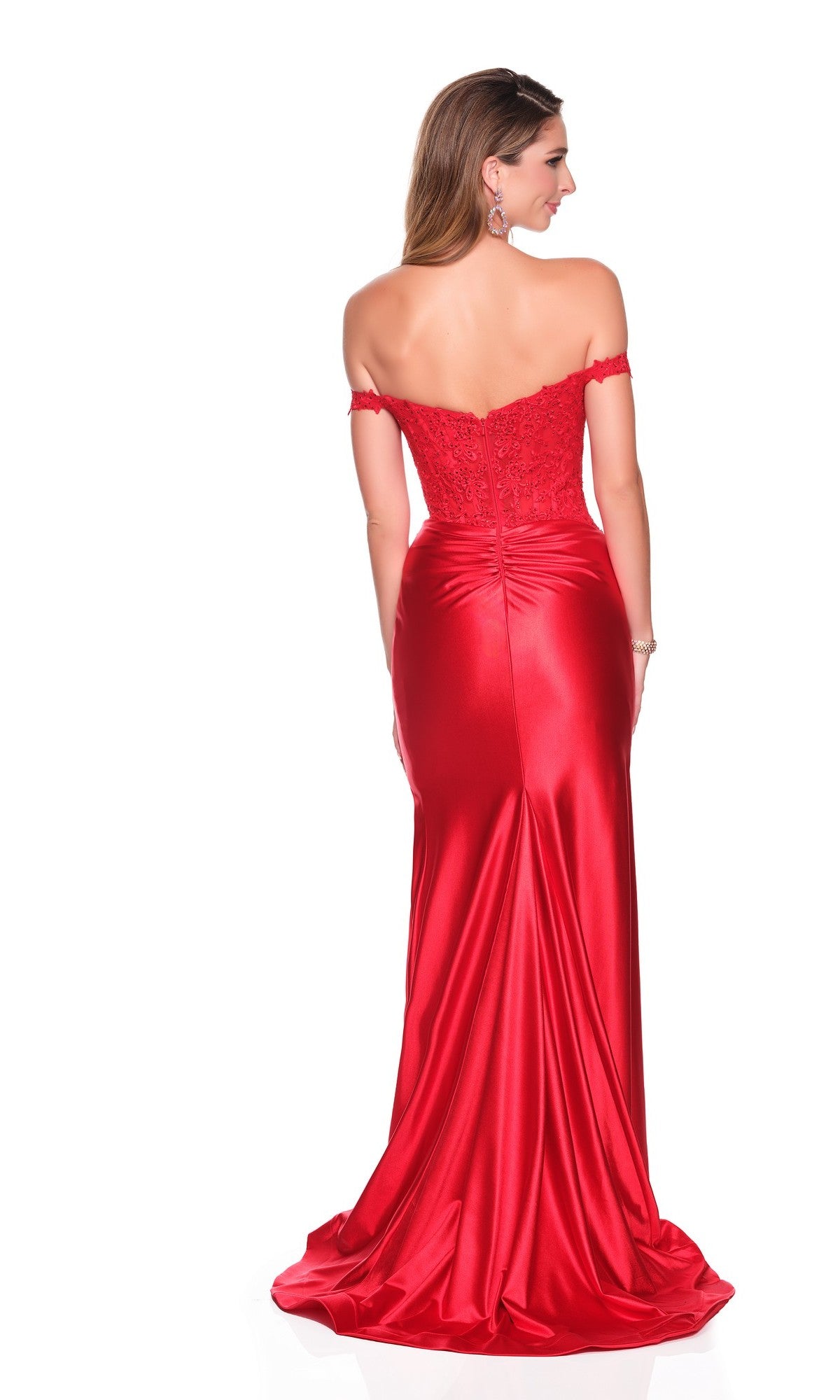 Woman in the Dave and Johnny 12802 long prom dress featuring a red off-the-shoulder lace corset bodice and fitted satin sheath skirt, standing with her back to the camera against a white background.